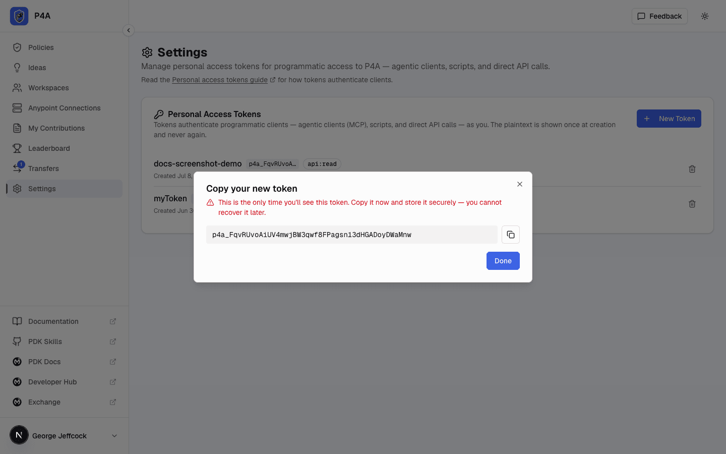 Reveal dialog showing the newly created token value with a copy button and a warning that it will not be shown again
