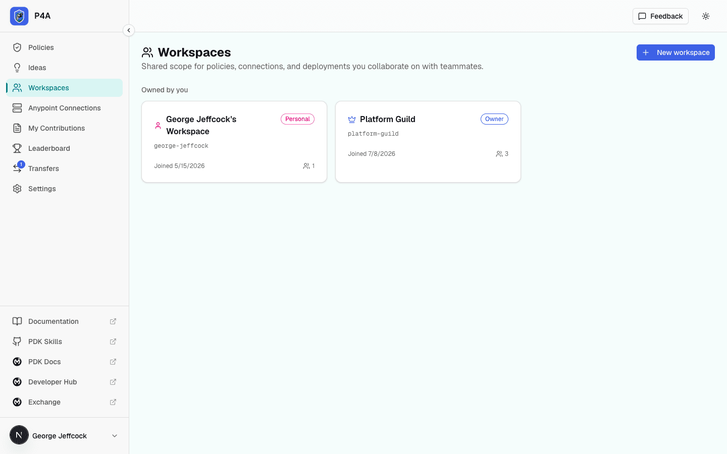 Workspaces page listing the signed-in user's personal and shared workspaces with their role